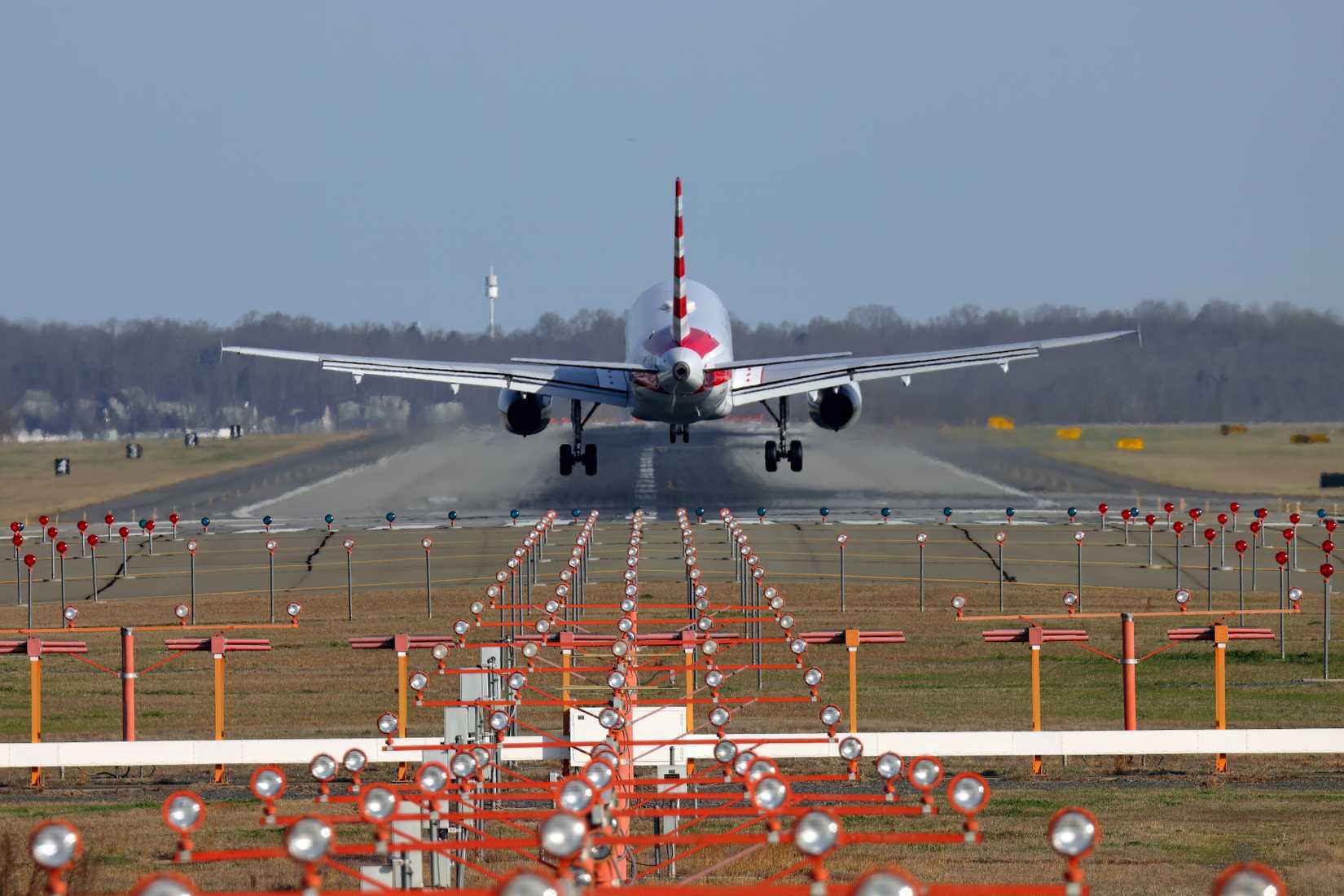 American Airlines jet landing from the approach lights, Charlotte Douglas International Airport, North Carolina