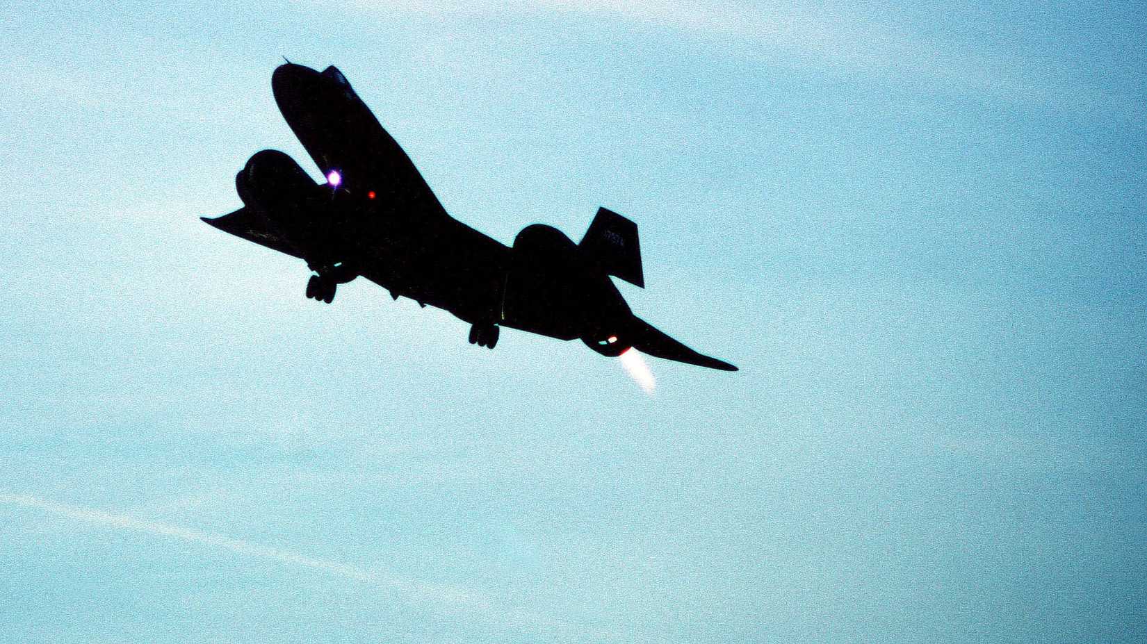 An air-to-air front view of an SR-71 aircraft