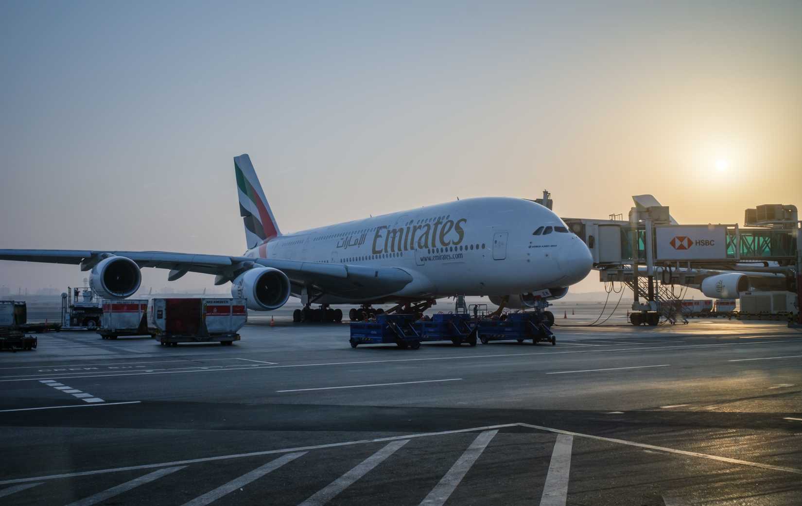 An Emirates Airlines Airbus A380 commercial airliner is parked at Dubai Airport