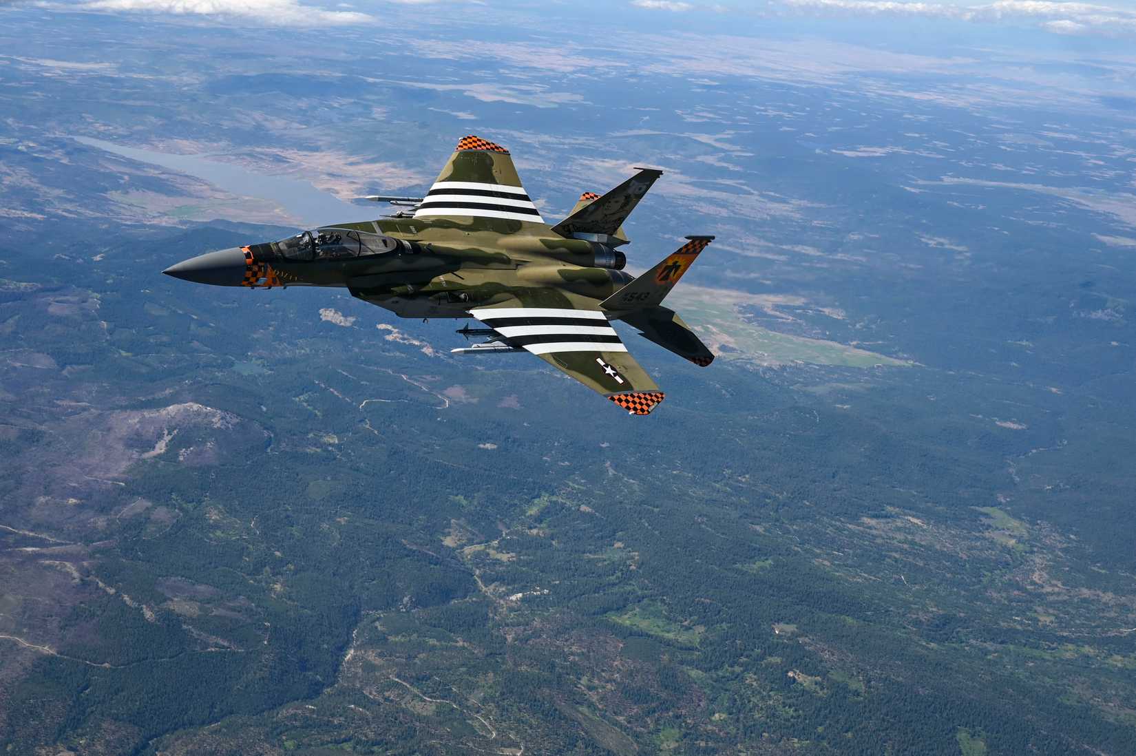 An F-15C Eagle assigned to the 142nd Fighter Wing departs after receiving fuel from a KC-135 Stratotanker
