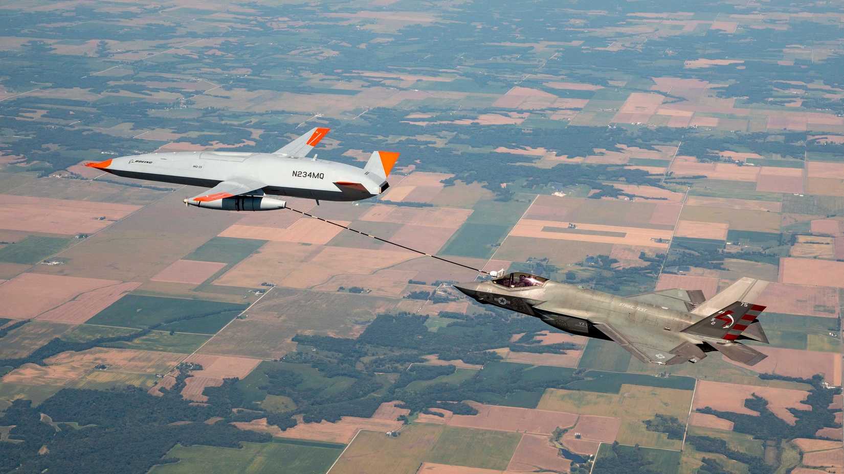 An MQ-25 test asset, known as T1, conducts its first aerial refueling test flight with an F-35C Lightning II