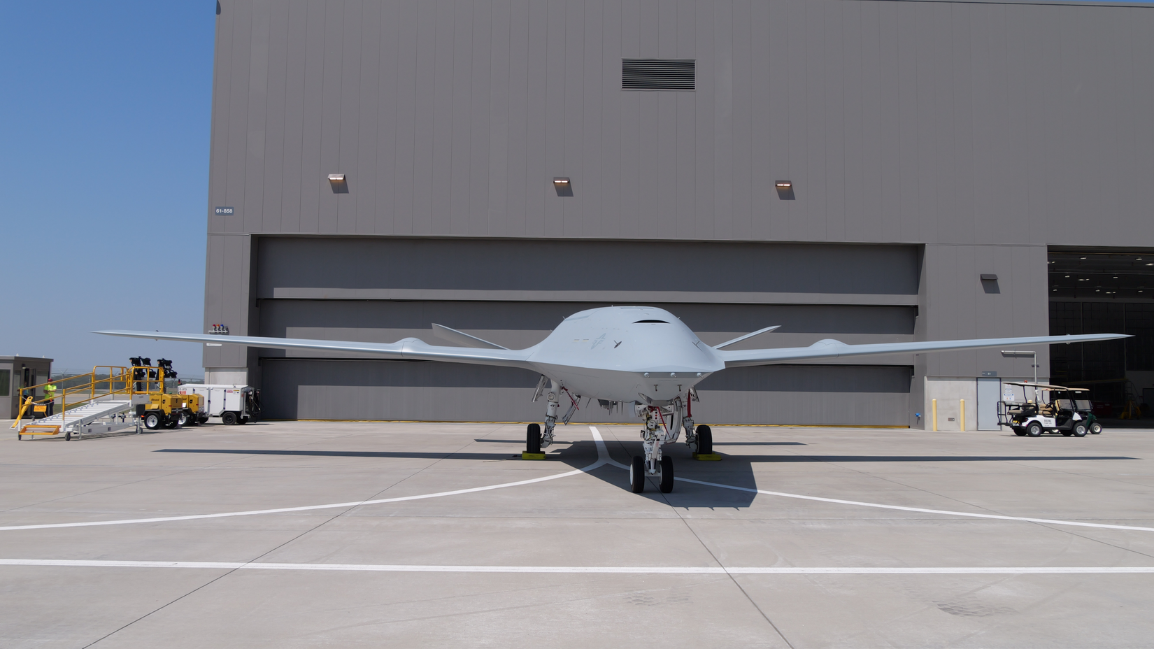 An MQ-25A freshly painted in U.S. Navy livery shown on the ramp in Illinois.