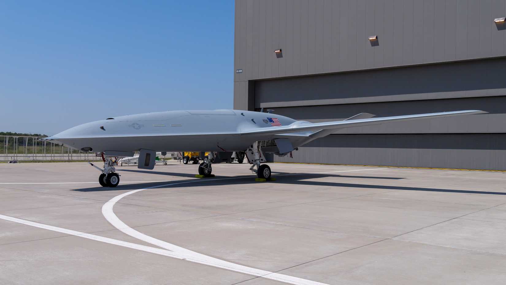 An MQ-25A freshly painted in U.S. Navy livery shown on the ramp.