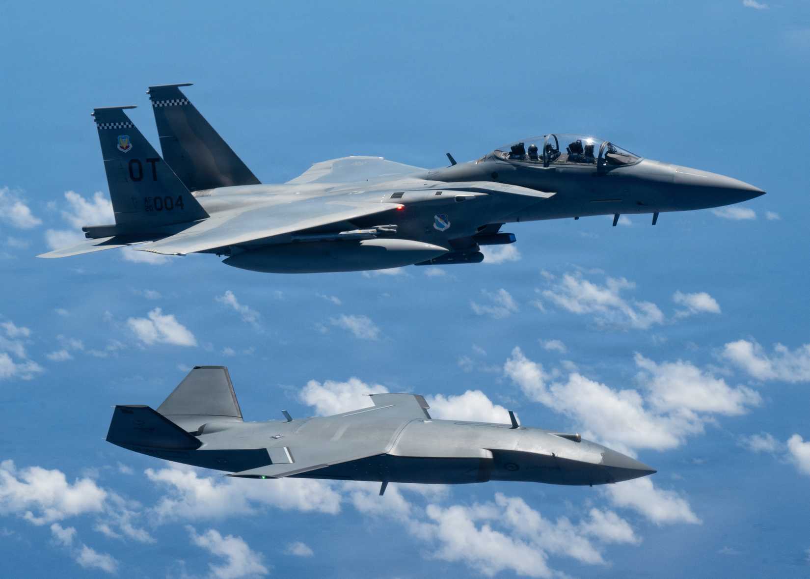 An MQ-28 Ghost Bat from Boeing Defense Australia and a U.S. Air Force F-15EX Eagle II