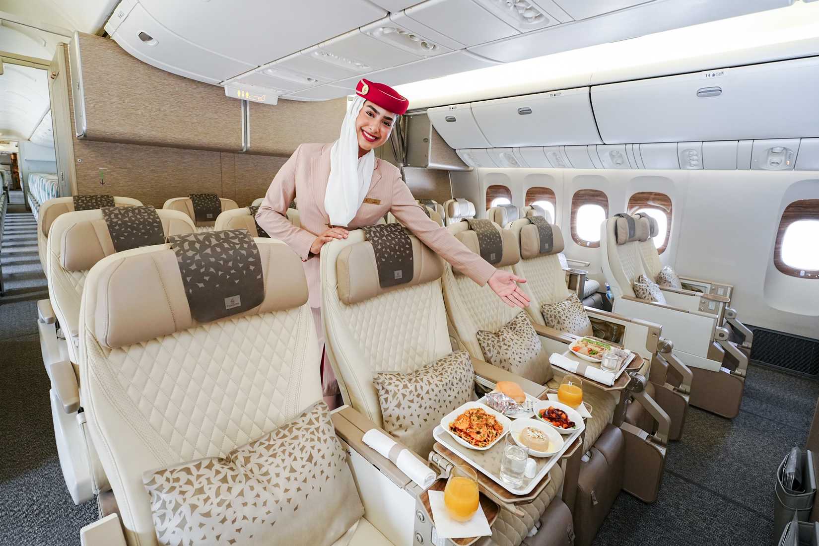 Emirates cabin crew in premium economy cabin on Boeing 777