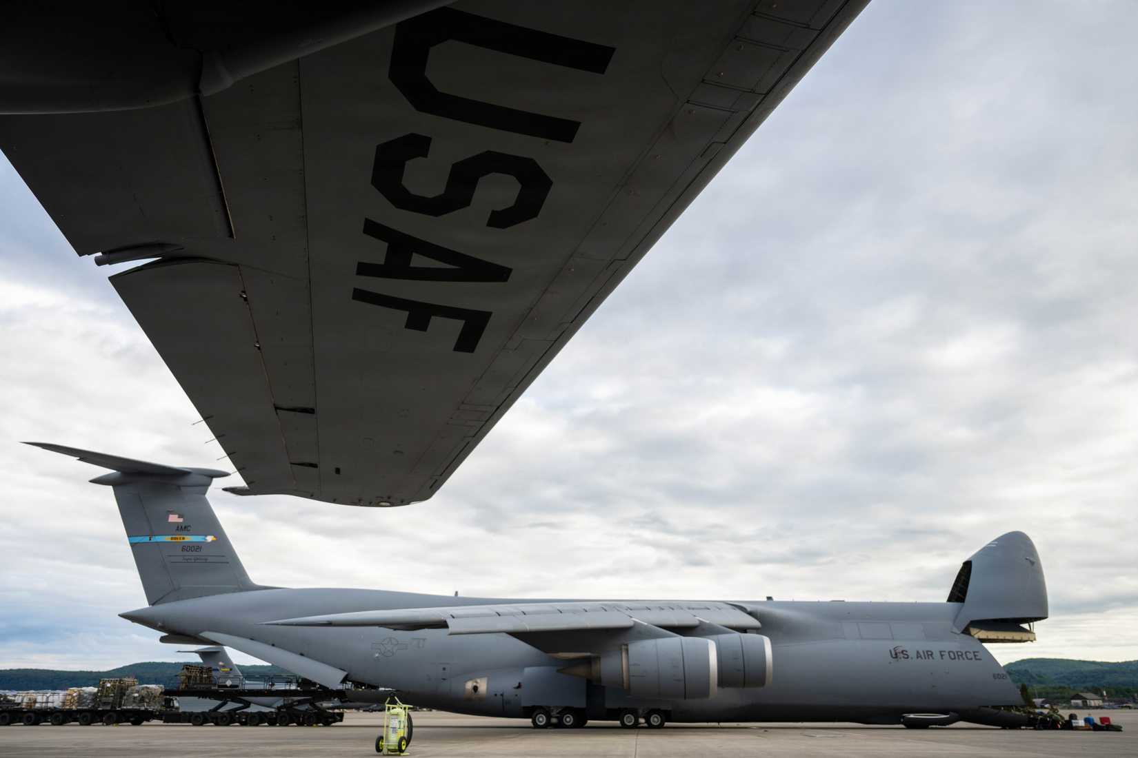 Cargo is extracted from a C-5M Super Galaxy at Ramstein Air Base, Germany