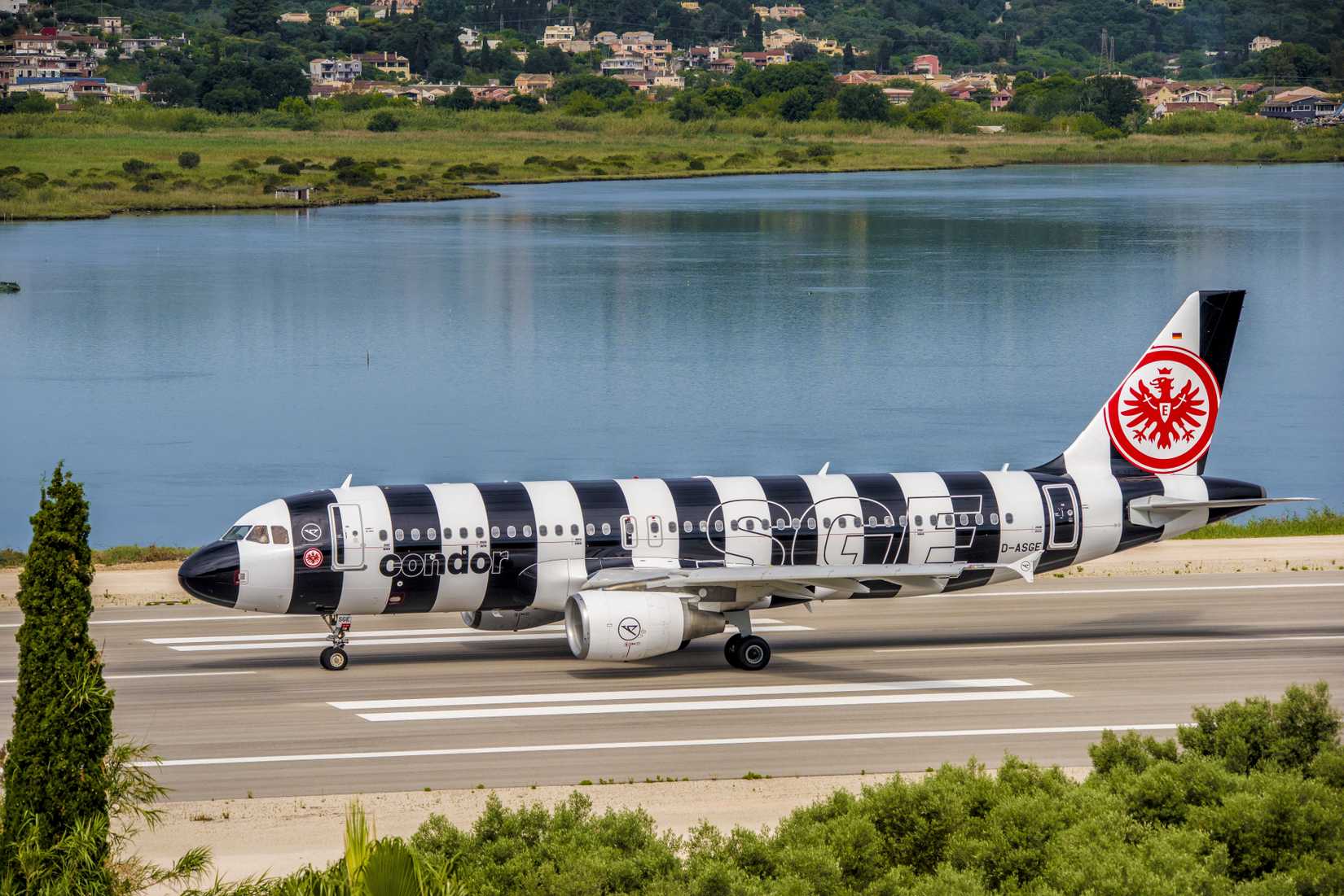 Condor Airbus A320 in special black-and-white striped livery descending for landing at Corfu Airport