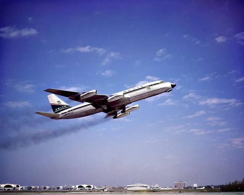 A phot of a Convair 880, just after takeoff, operating under Delta Air Lines.