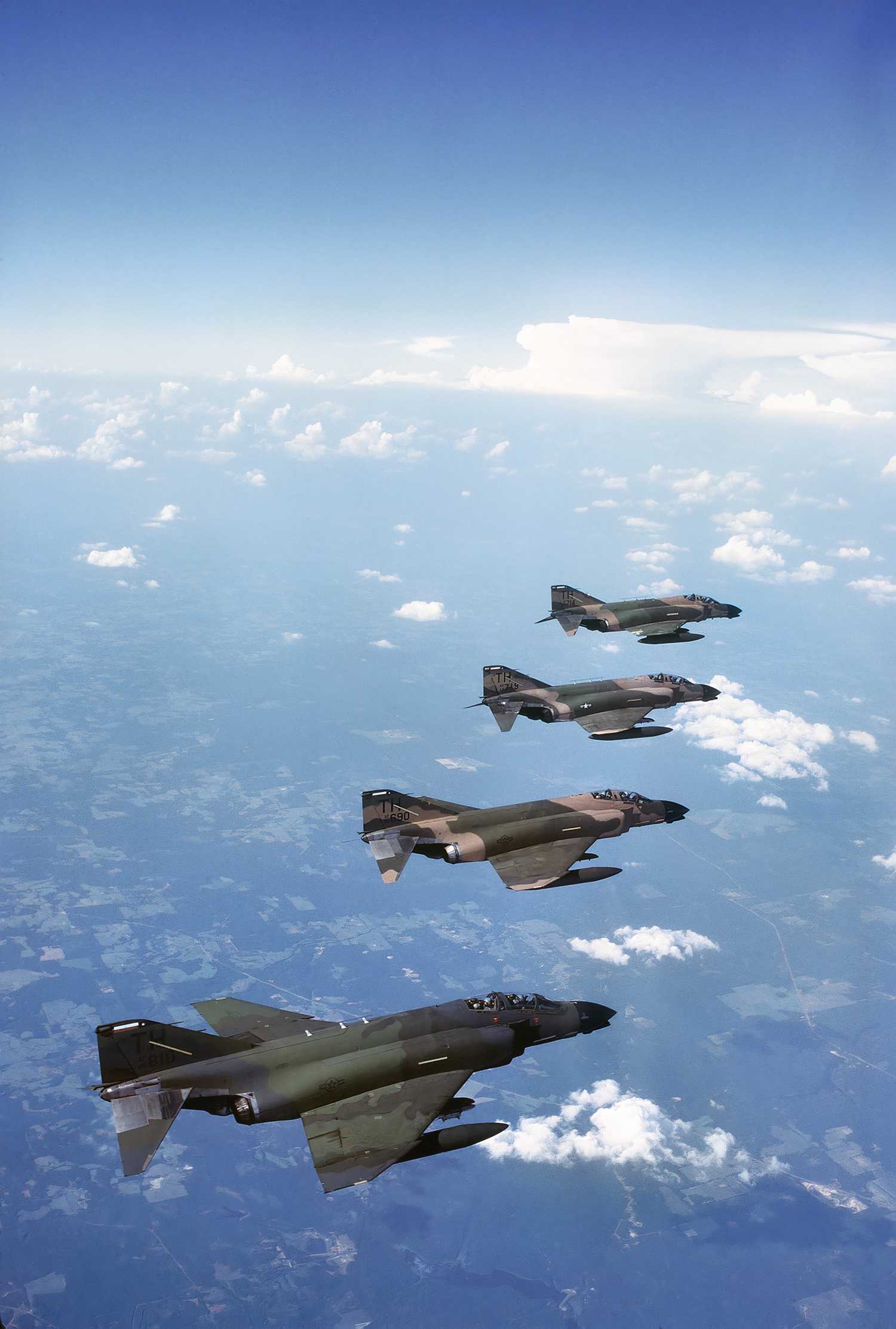 A photo of four F-4 Phantoms flying in formation.