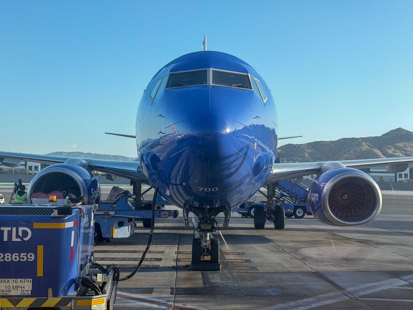 Head-on view of a Southwest Boeing 737 nose parked at Burbank Airport gate