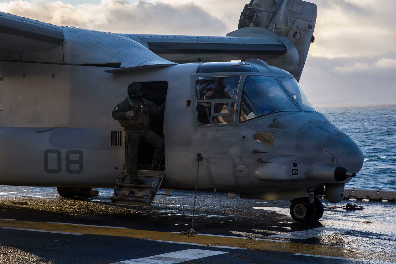 Marine prepares for take-off in a V-22 Osprey