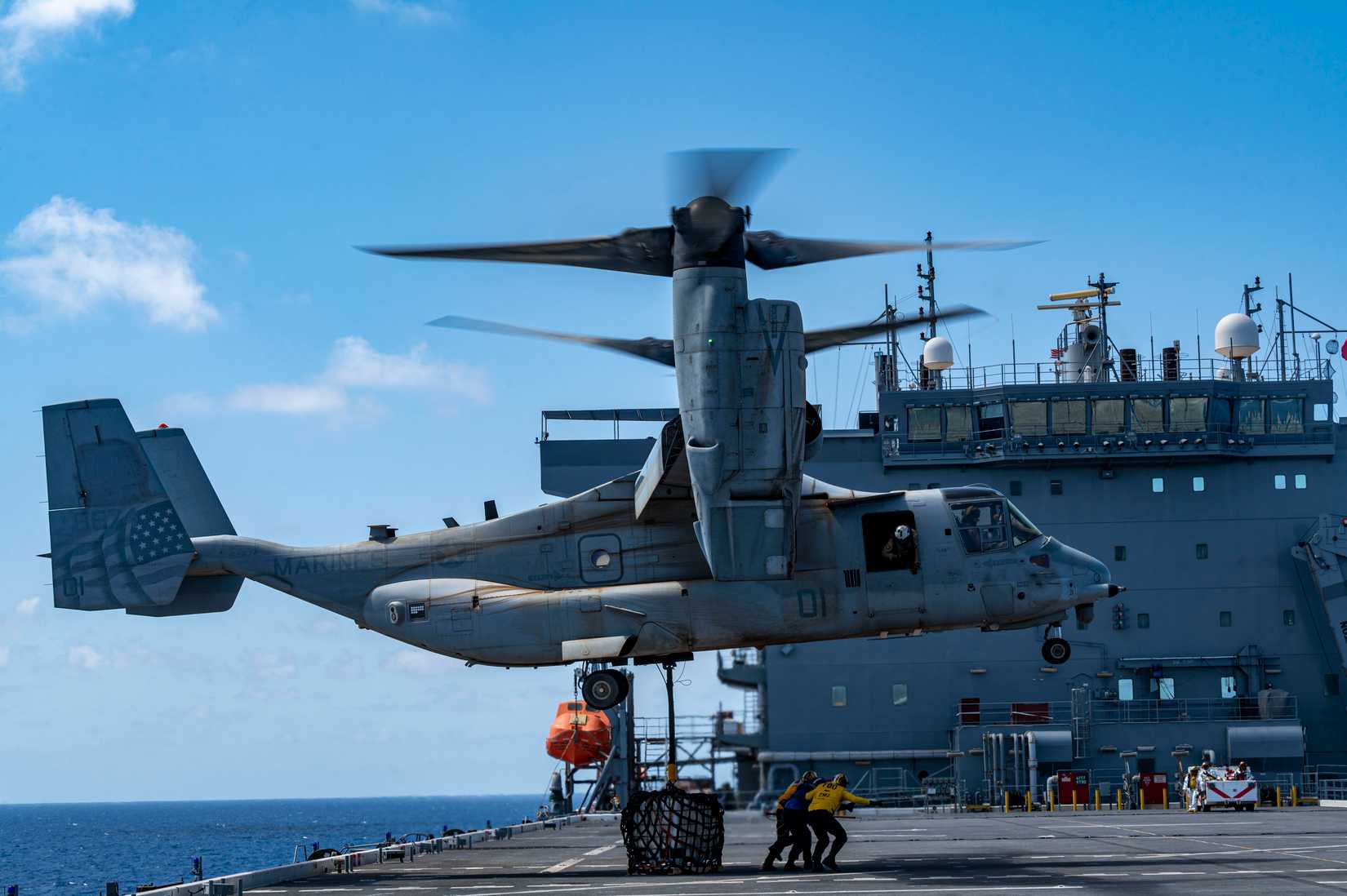 Marines assigned to Marine Medium Tiltrotor Squadron 364 (REIN), land an MV-22B Osprey on the USS Lewis B Puller in the Red Sea