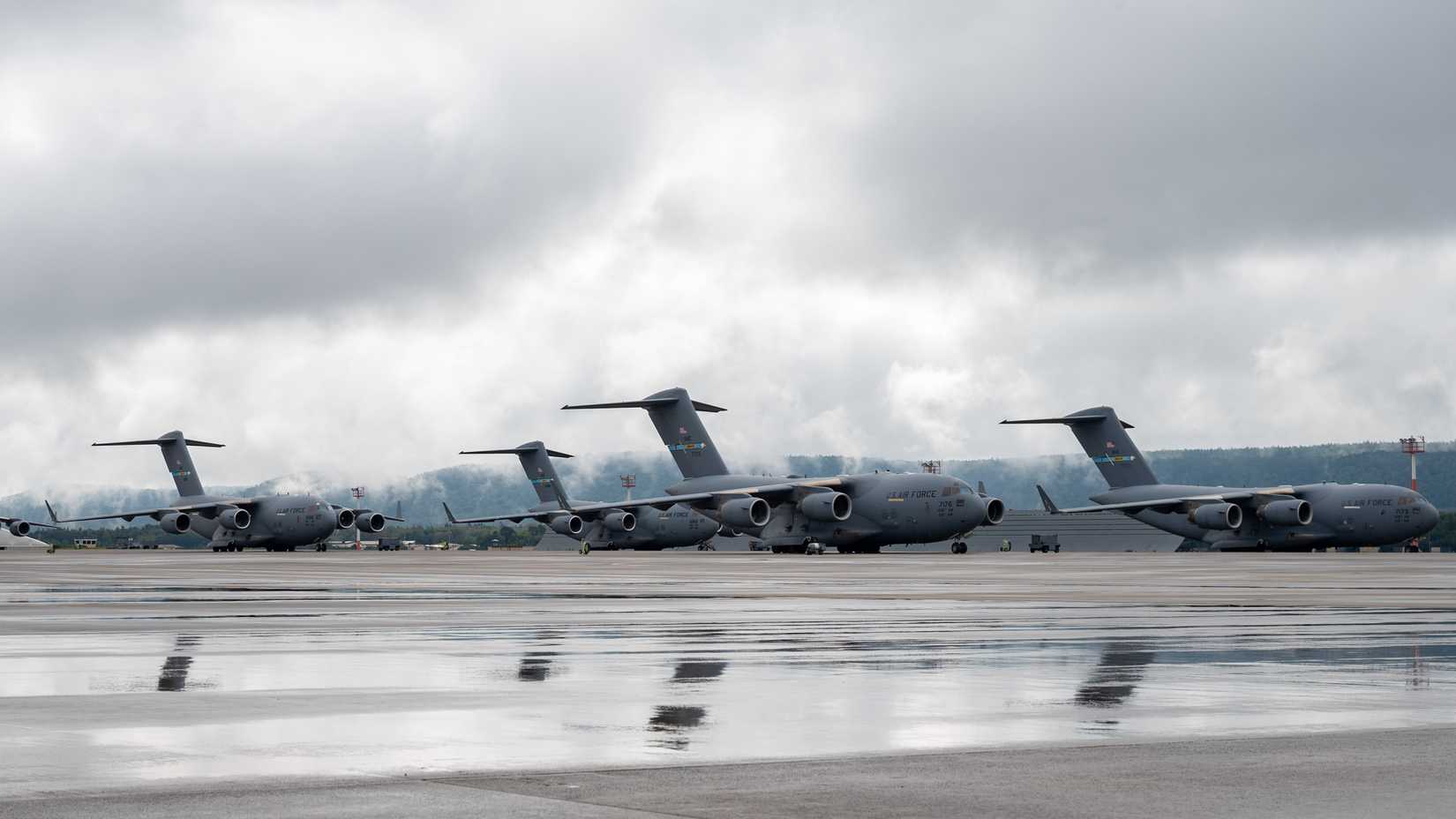 Multiple C-17 Globemaster III aircraft park on the flight line at Ramstein Air Base, Germany