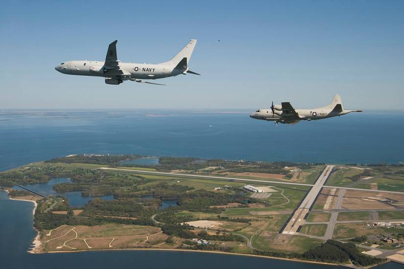 The US Navy’s newest maritime patrol and reconnaissance test aircraft, P-8A Poseidon flies with a P-3C Orion along side, prior to landing at Naval Air Station Patuxent River