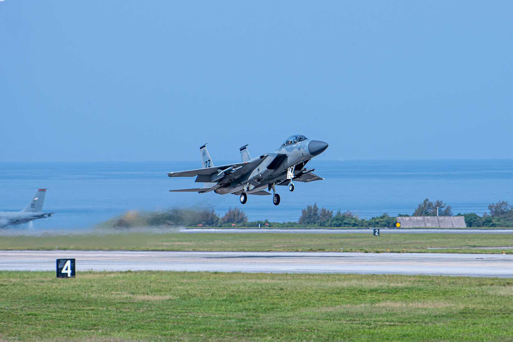 Pacific Air Forces commander, and Capt. James Armstrong, 67th Fighter Squadron Pilot, take off from Kadena Air Base