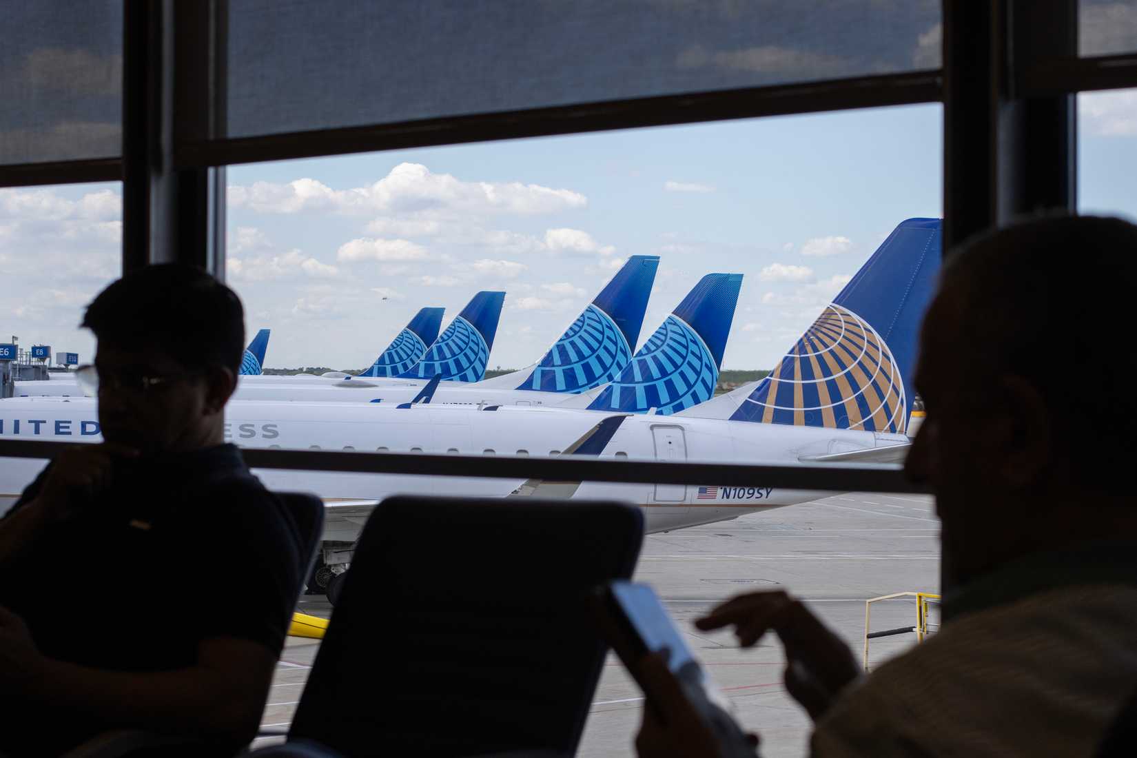 Passengers waiting at the terminal gates for United Airlines flights at Chicago O'Hare International Airport