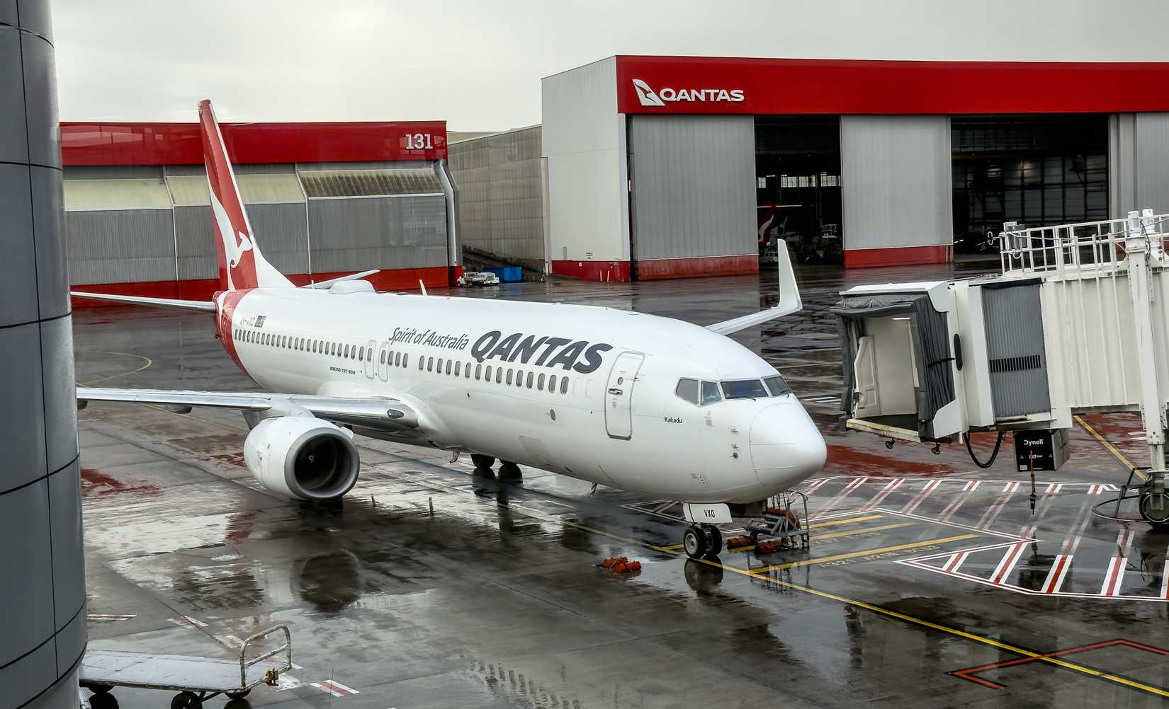 Qantas Boeing 737-800 at terminal hangar