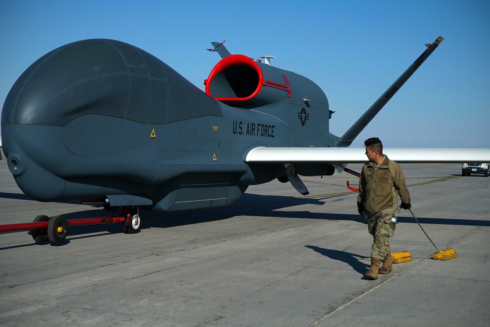 RQ-4 Global Hawk aircraft as it’s towed across the flight line