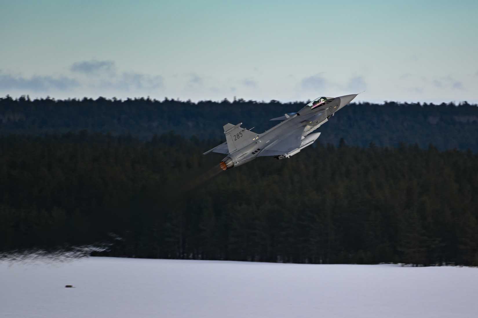 Saab JAS 39 Gripen C takes off for an integrated training sortie at Luleå-Kallax Air Base, Sweden