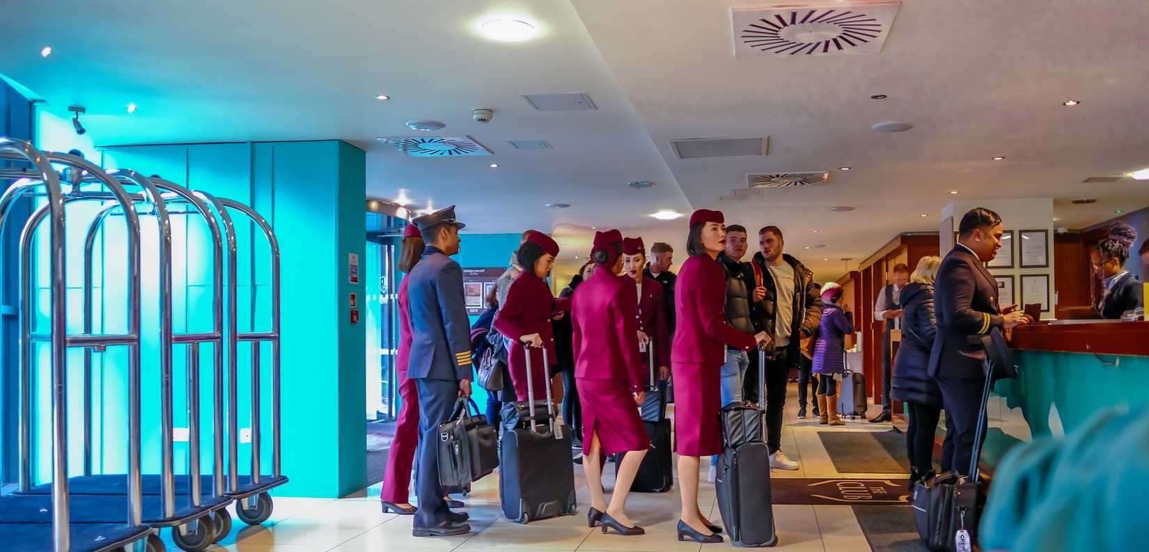 Qatar Airways crew at hotel reception in Manchester