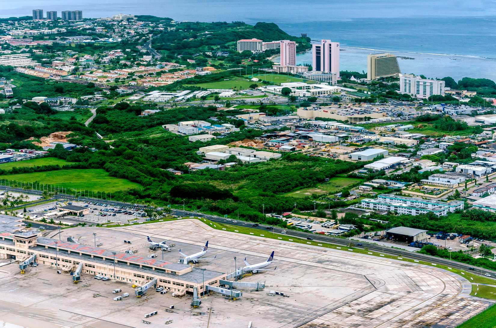 Guam - June 2016: Aerial of Antonio B. Won Pat International Airport and Tumon Bay