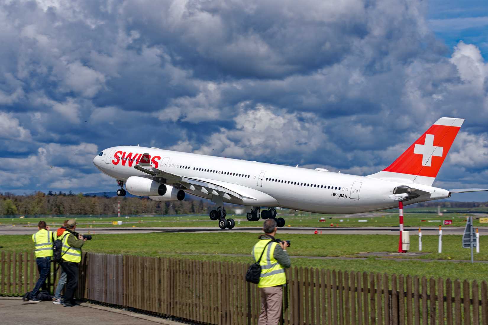 Swiss Airbus A340-313 HB-JMA taking off from Swiss Airport Zürich Kloten on a sunny spring day. Photo taken April 14th, 2023, Kloten, Canton Zurich, Switzerland.