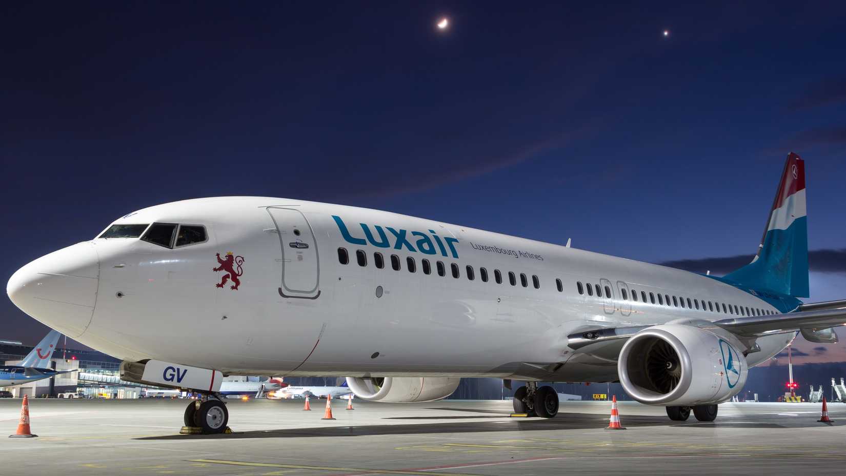 CRACOW, PL - Mar 01, 2017: A Boeing 737-800 from Luxair parked on an airport ramp in the evening