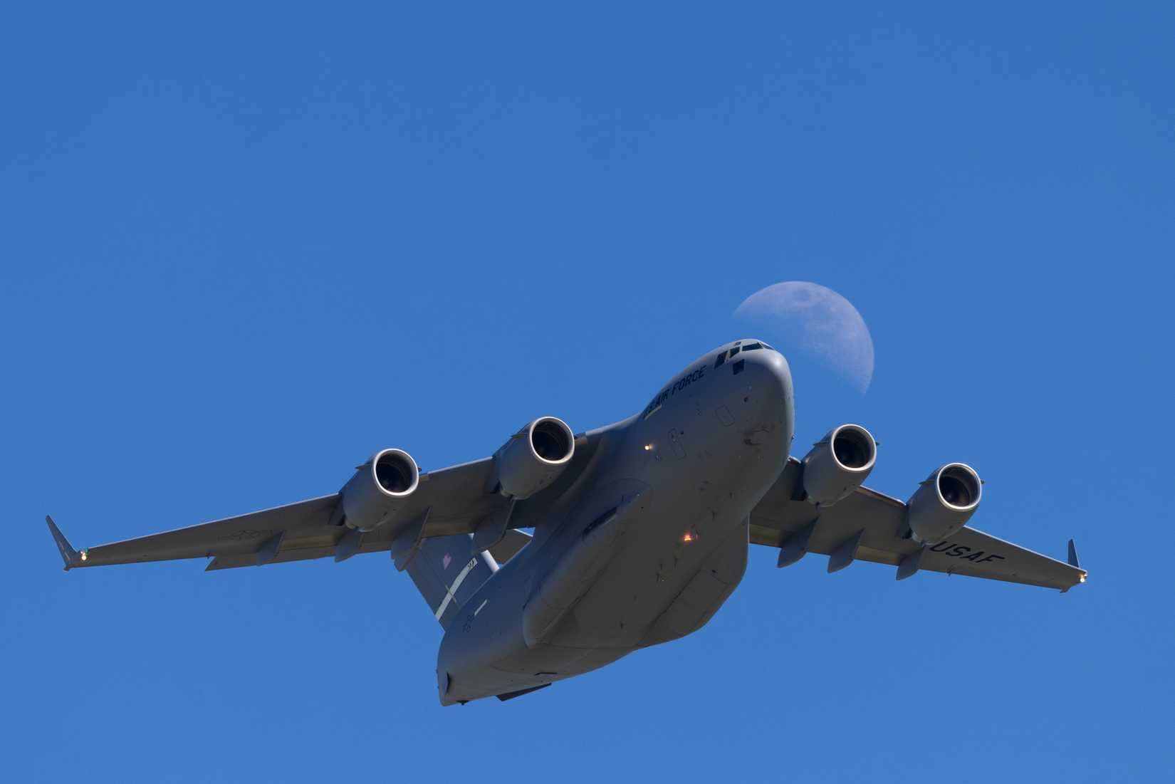 C-17 Globemaster III against the moon 