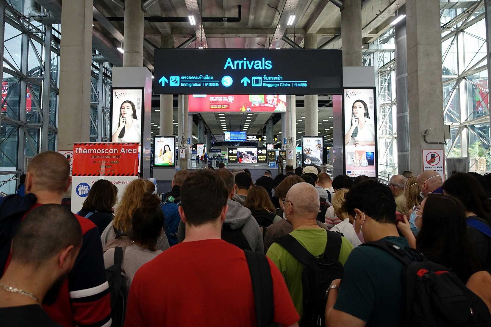 Passengers In Busy Airport