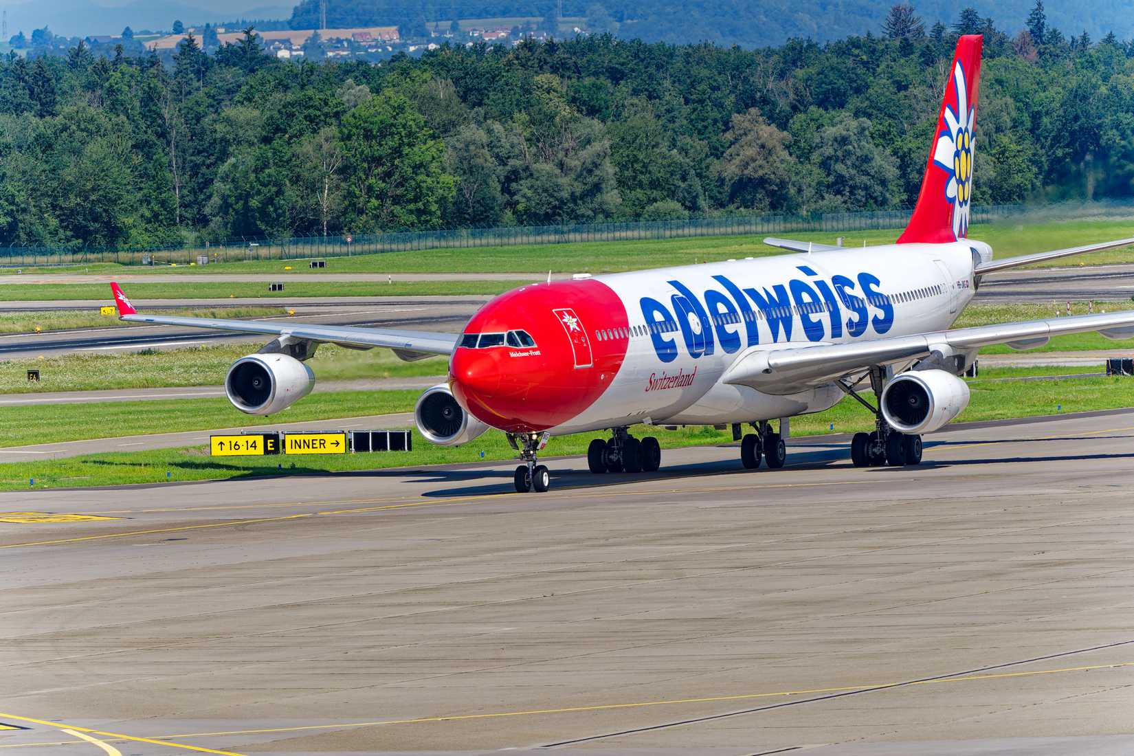 Edelweiss Air Airbus A340-300 HB-JMG airplane taxiing to dock at Swiss airport Zürich Kloten on a sunny summer day. Photo taken July 30th, 2024, Zurich, Switzerland.