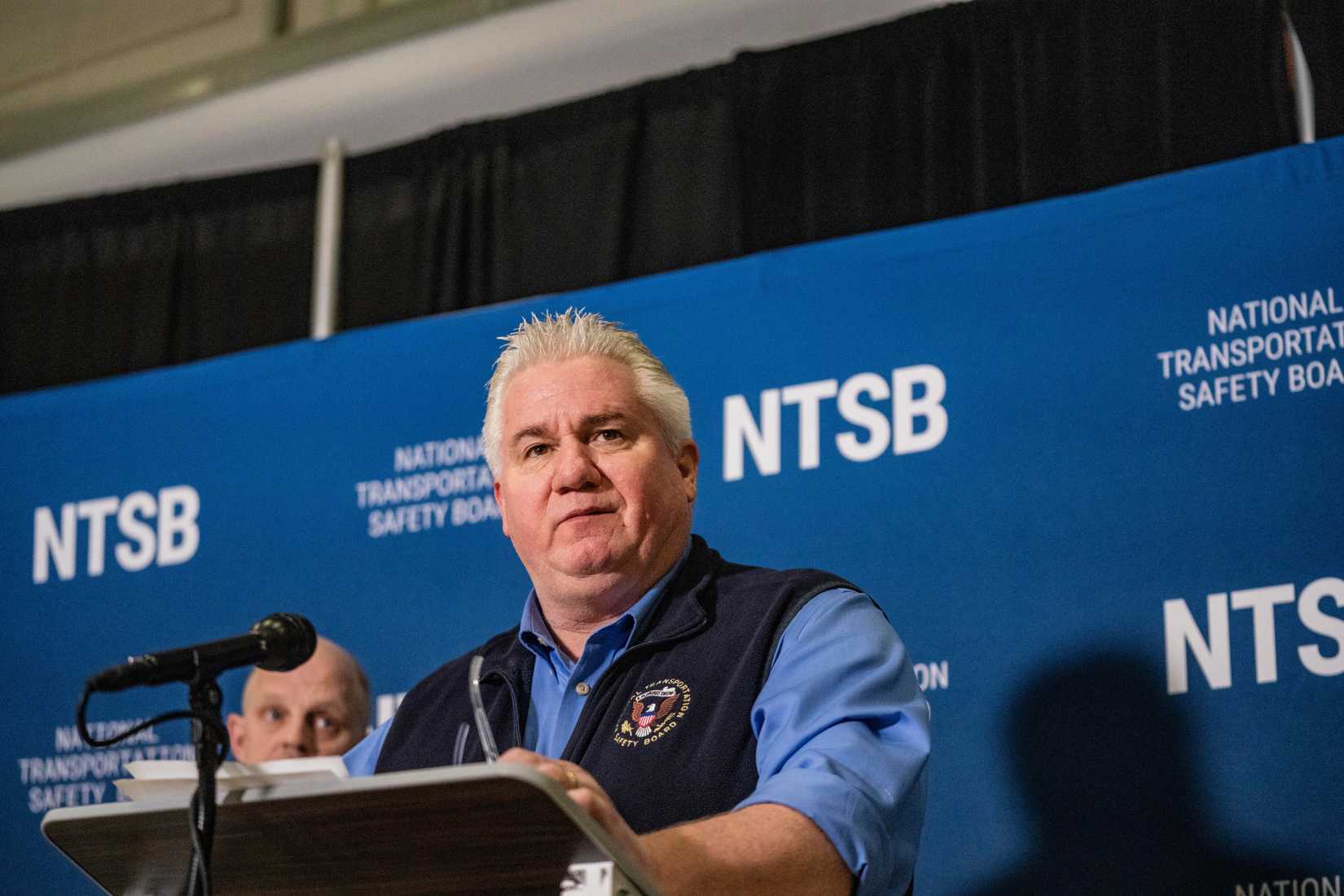NTSB agent at the podium