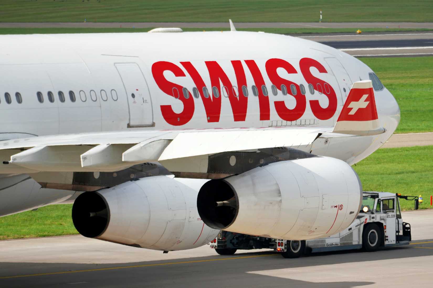 Zurich, Switzerland - November 1 2024: A Swiss Air A340 is tugged to its gate at Zurich airport