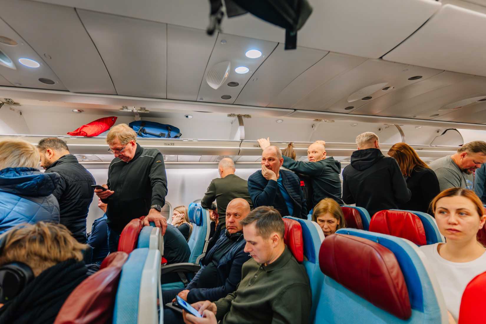 passengers in aircraft cabin during boarding