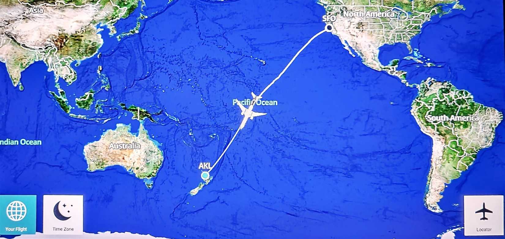 SAN FRANCISCO, CALIFORNIA, OCTOBER 10, 2023: In-flight map display shows the transpacific route from San Francisco (SFO) to Auckland (AKL) over the Pacific Ocean during a long-haul flight.