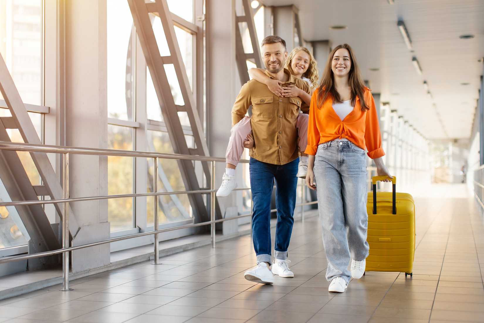 Family walking through airport