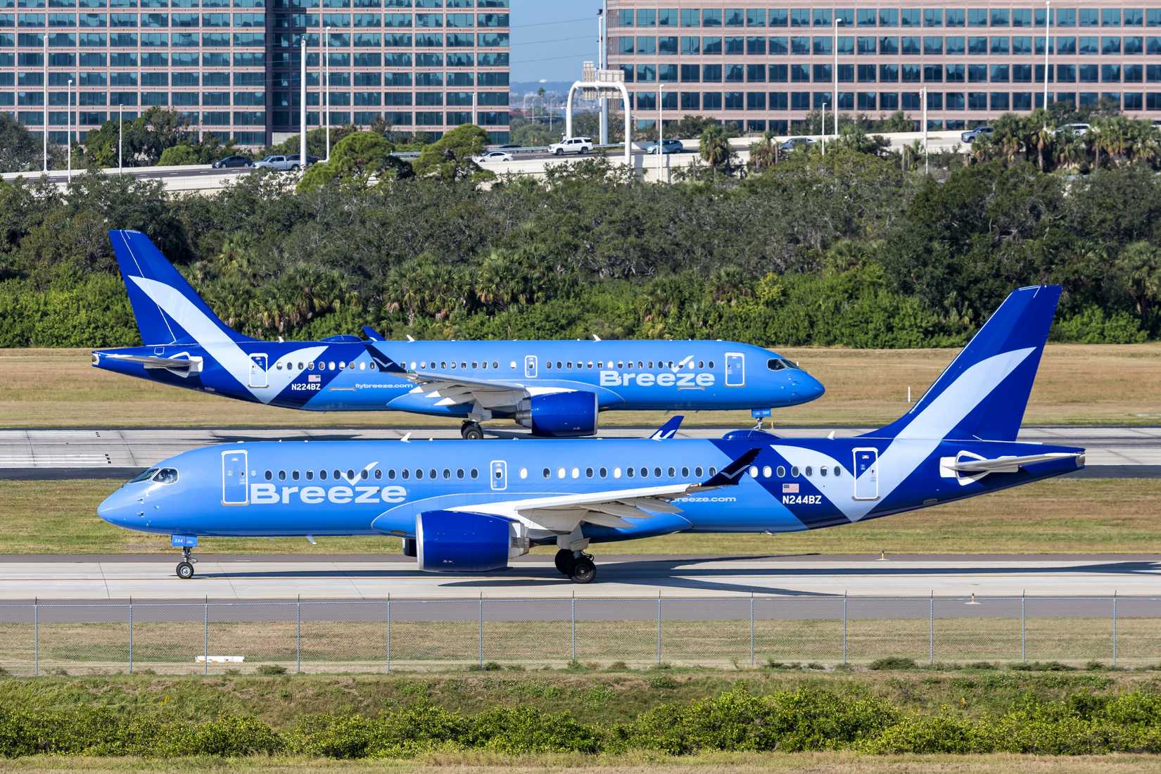 Tampa, United States - November 7, 2025: Breeze Airways Airbus A220-300 airplanes at Tampa airport in the United States.