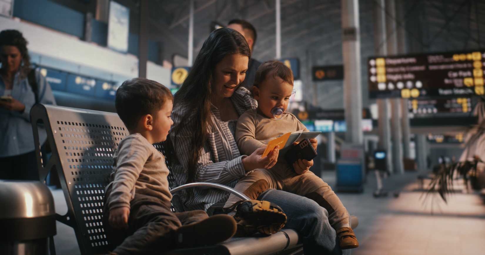 Mother at airport with two young children