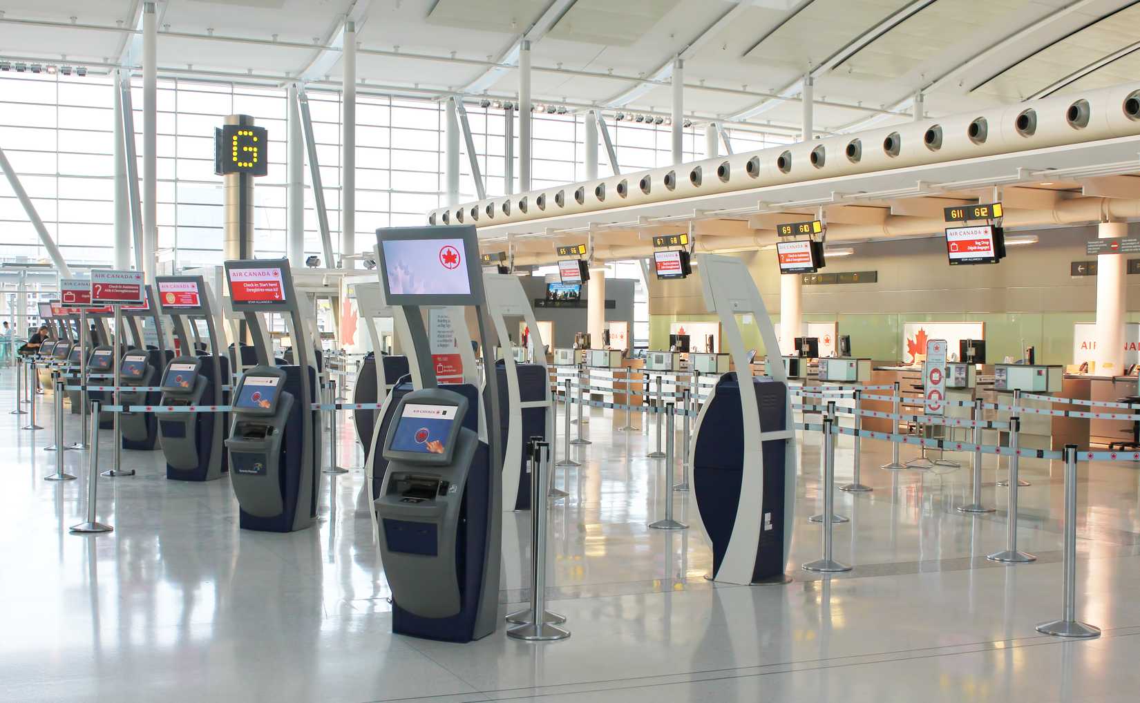 Self-service check-in kiosks and check-in counters at Pearson International Airport
