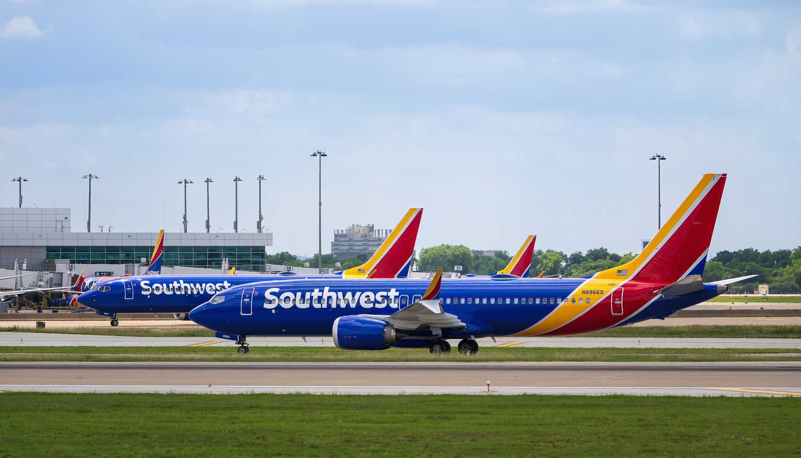 Southwest Airlines aircraft lined up on the runway at the Dallas Love Field Airport