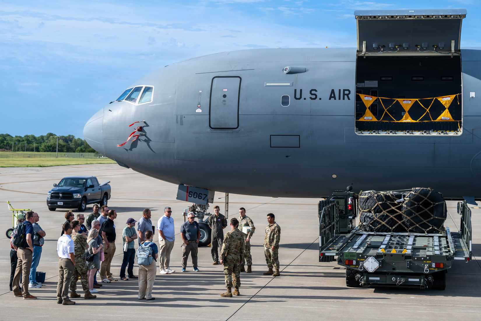 Summer Industry Preview participants gather beside a KC-46A Pegasus