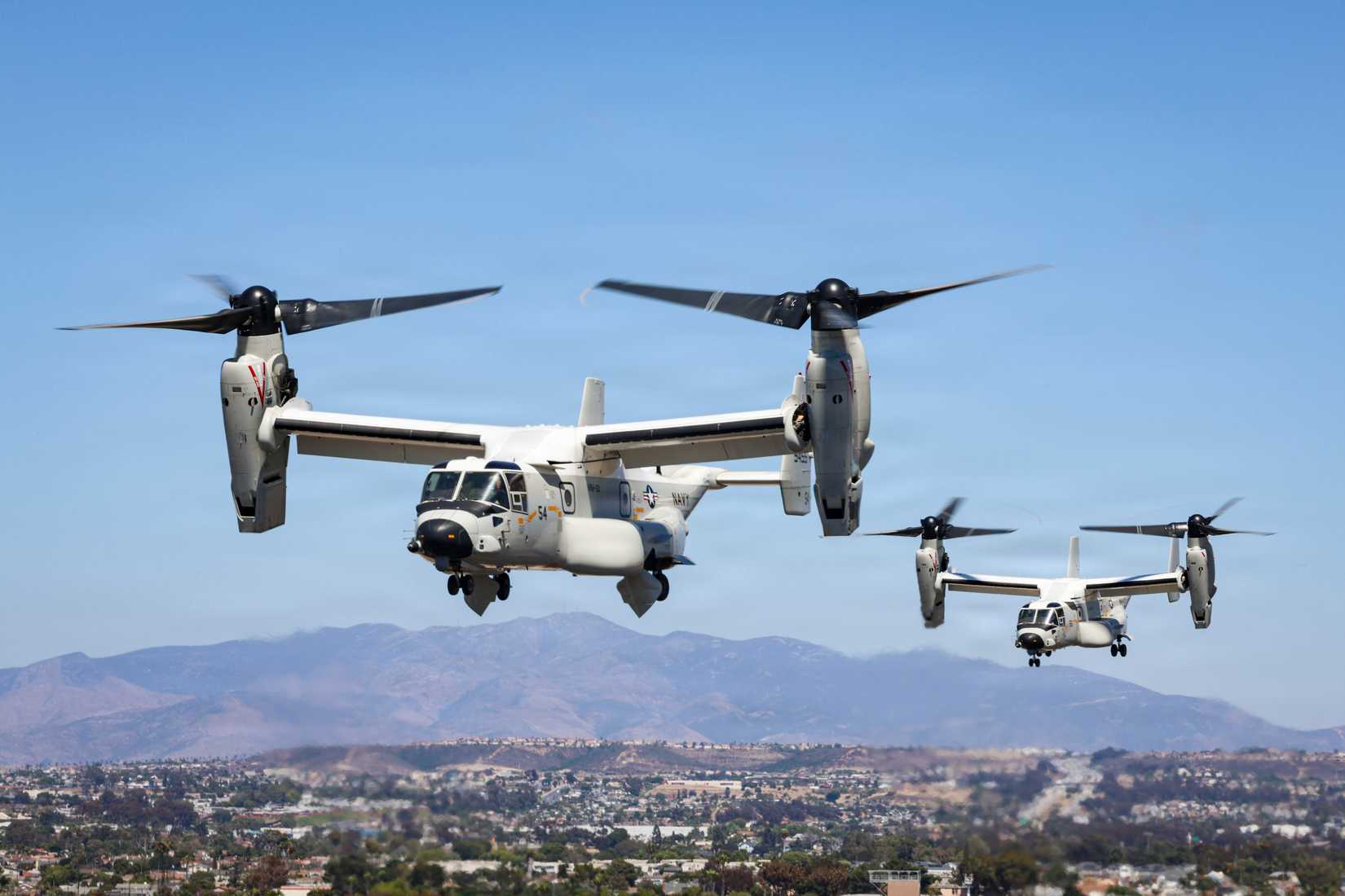 Two CMV-22B Osprey tiltroter aircraft of Fleet Logistics Multi-Mission Squadron (VRM) 50 take off from Naval Outlying Landing Field Imperial Beach