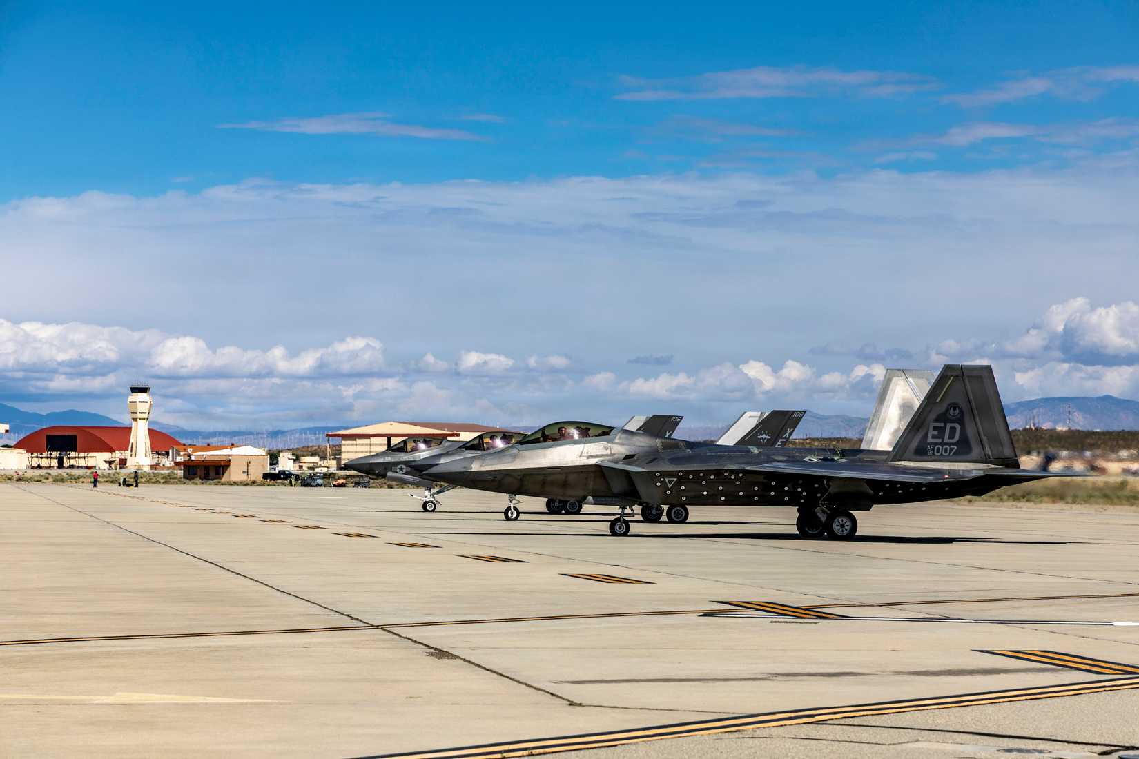 Two F-35C's assigned to Navy's Air Test and Evaluation Squadron Nine (VX-9) and an F-22 at Edwards
