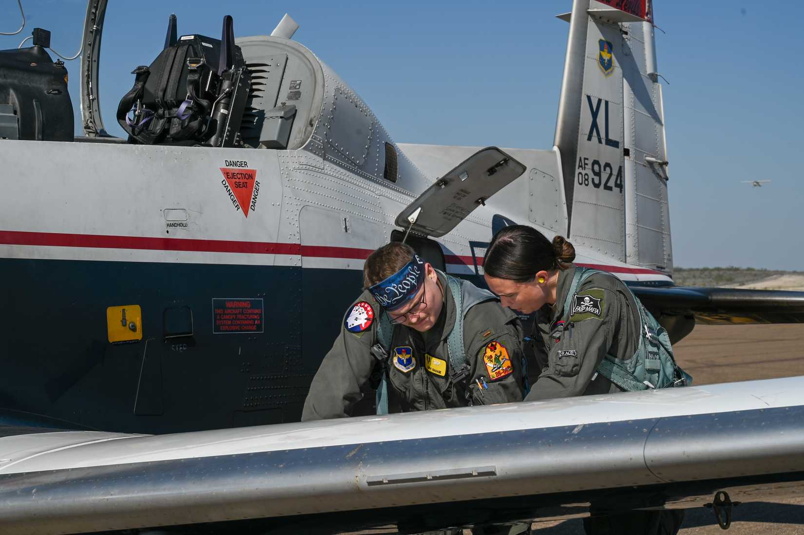 U.S. Air Force 2nd Lt. Cody Savage, 47th Student Squadron student pilot, and 1st Lt. Gracie O’Brien, 434th Flying Training Squadron instructor pilot, conduct pre-flight inspections