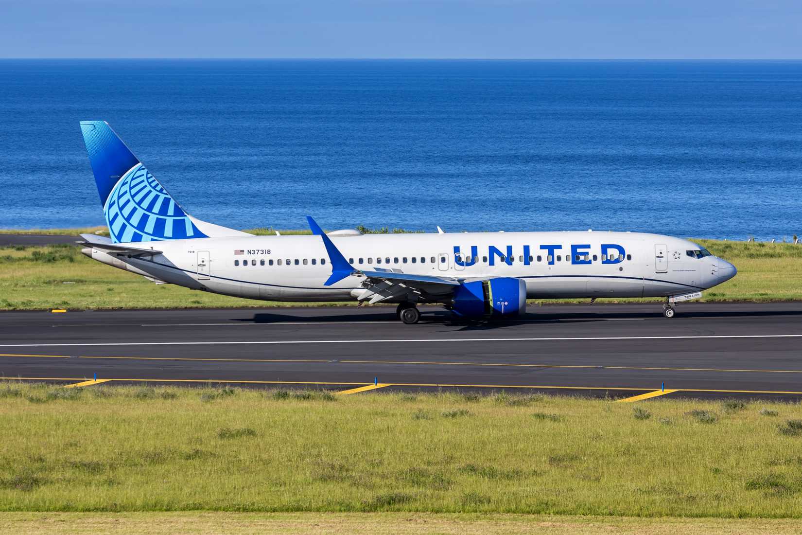 United Airlines Boeing 737 MAX 8 airplane taxis for takeoff
