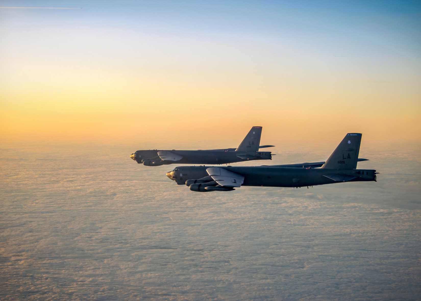 Two B-52H's, assigned to the 96th Bomb Squadron fly in formation above the clouds, somewhere over the Baltic Sea.