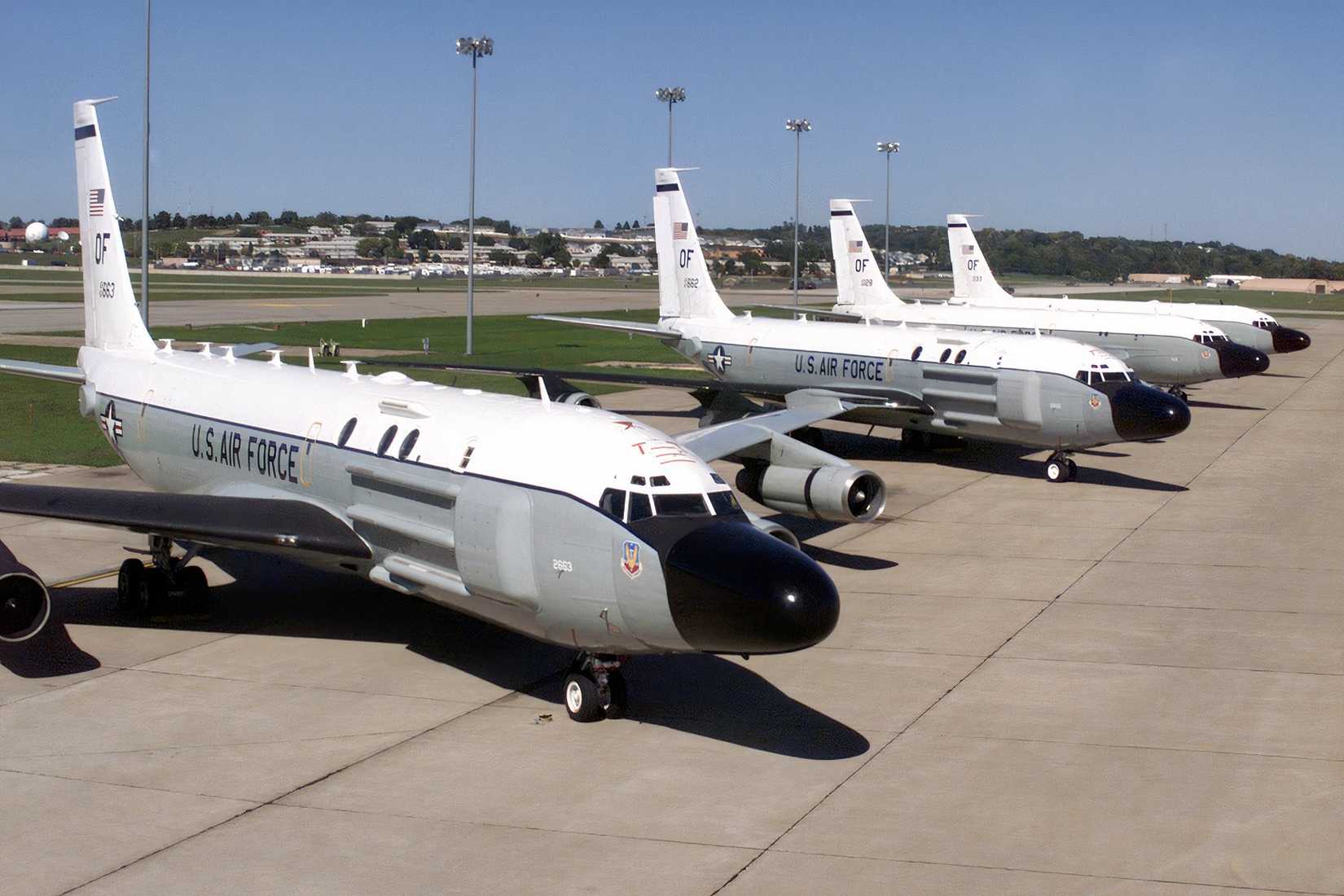 A photo showing four RC-135s parked next to each other, on an apron.