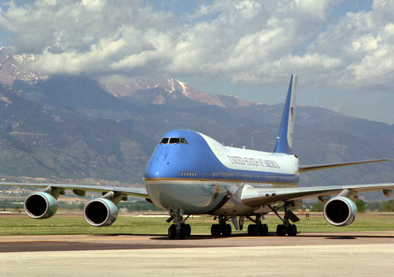 With Pike's Peak in the background, Air Force One, a VC-25A aircraft, stands on the flight line after arriving on base.