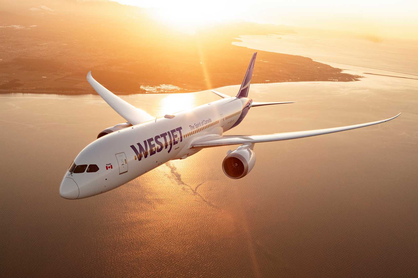 WestJet Boeing 787-9 flying at sunset