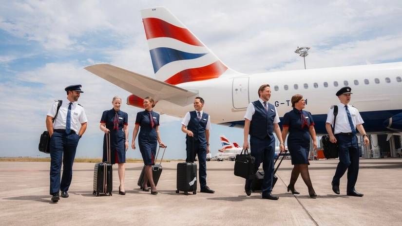 British Airways flight crew and cabin crew with cases outside A320