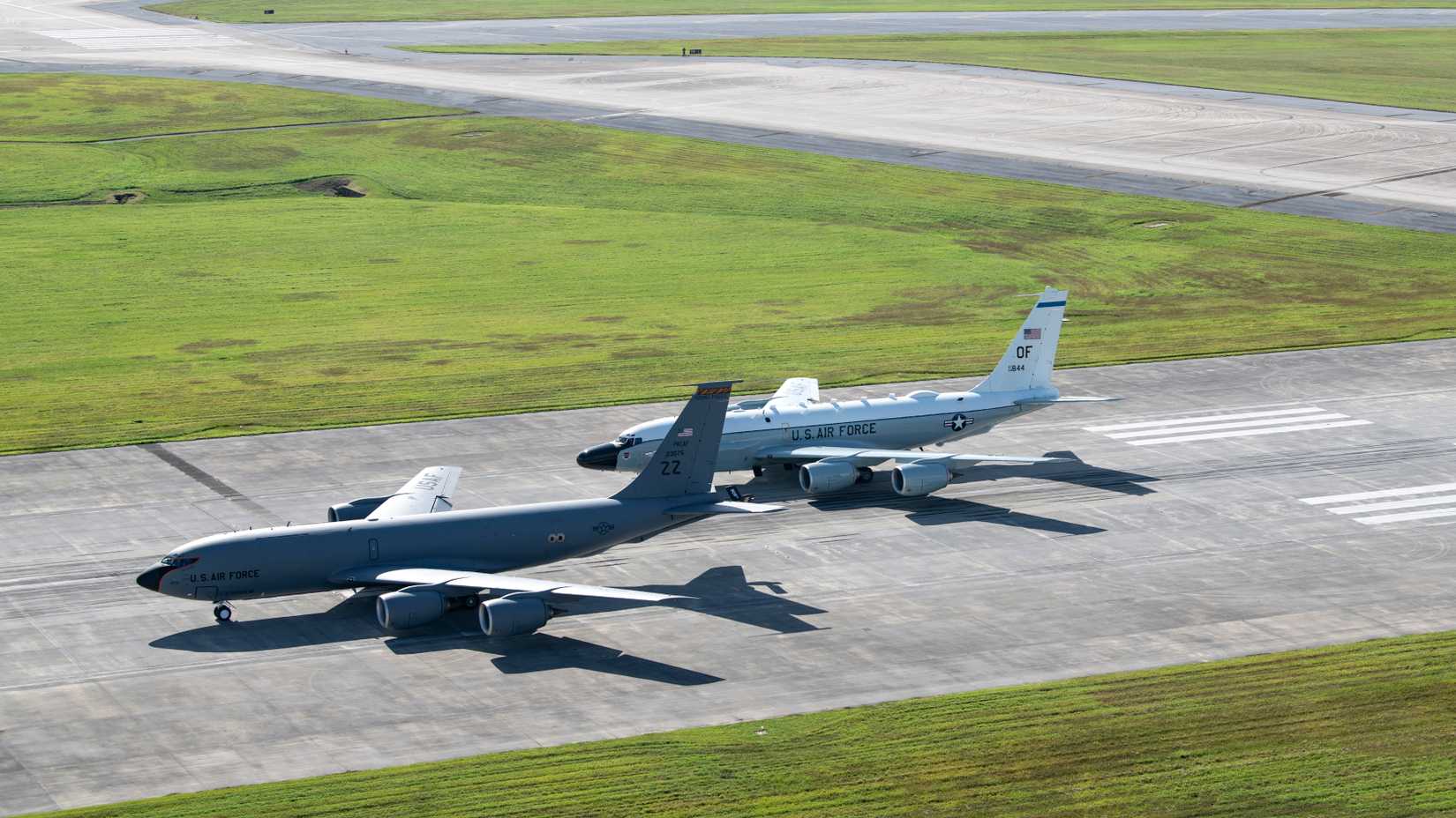  909th Air Refueling Squadron KC-135 Stratotanker and an 82nd Expeditionary Reconnaissance Squadron RC-135 Rivet Joint are stopped on the runway